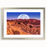 Textured art print of abstract Death Valley landscape, in muted earth tones, framed in silver, ideal for bedroom decor.