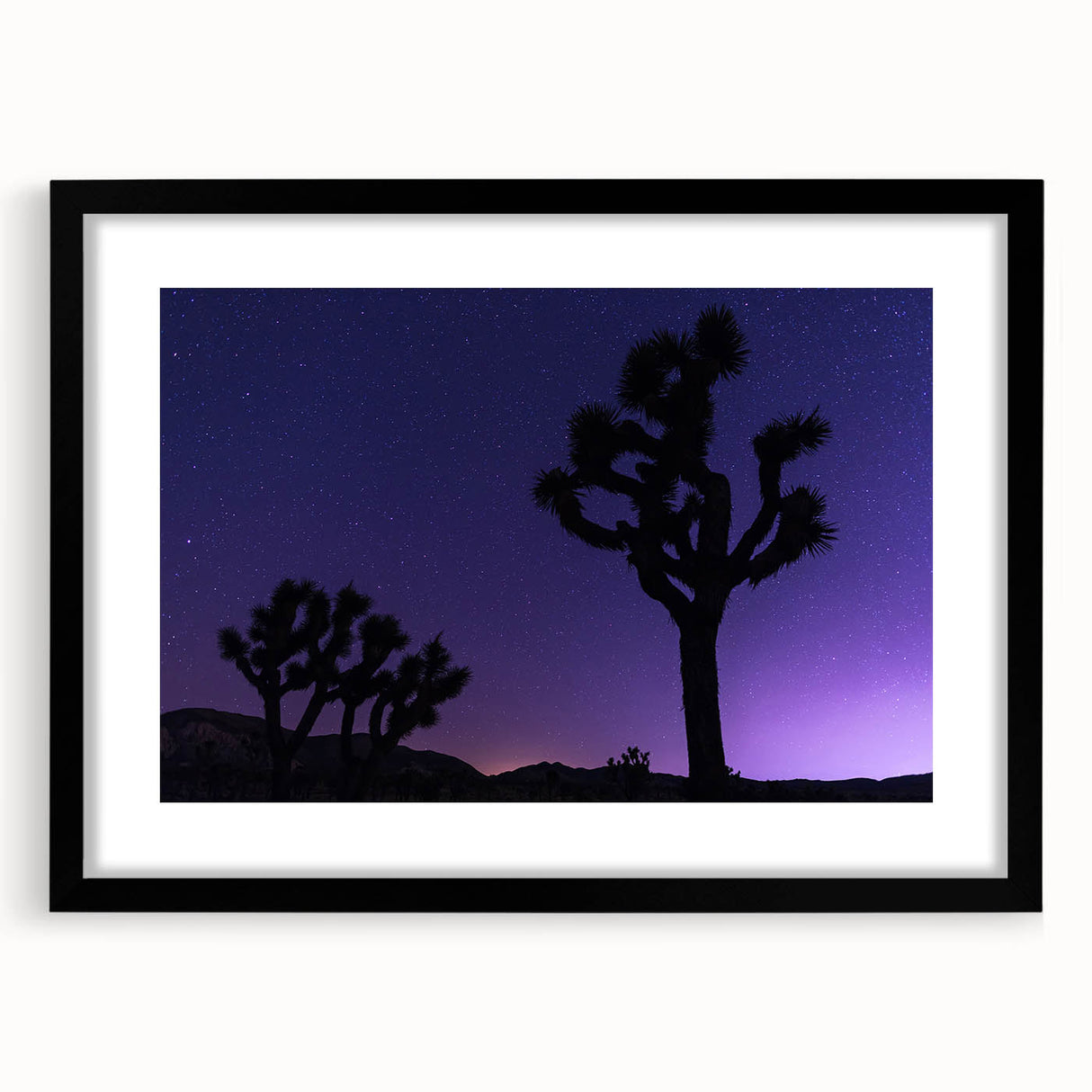 Extra large framed wall art of an abstract Joshua Tree in vibrant, textured colors on canvas, ideal for living room decor.