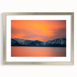 Textured abstract art print of Lake Tahoe in muted blue and gray tones on a silver-framed canvas, suitable for bedroom decor.
