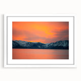 Abstract art print of Lake Tahoe in muted blue and green tones, framed in white, ideal for dining room decor.