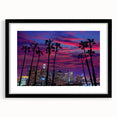 Abstract art print of Los Angeles skyline in vibrant colors on a large textured canvas, framed in black.
