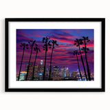 Abstract art print of Los Angeles skyline in vibrant colors on a large textured canvas, framed in black.