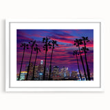 Abstract art print of Los Angeles skyline in muted gray and blue tones on a framed white mat, suitable for dining room decor.