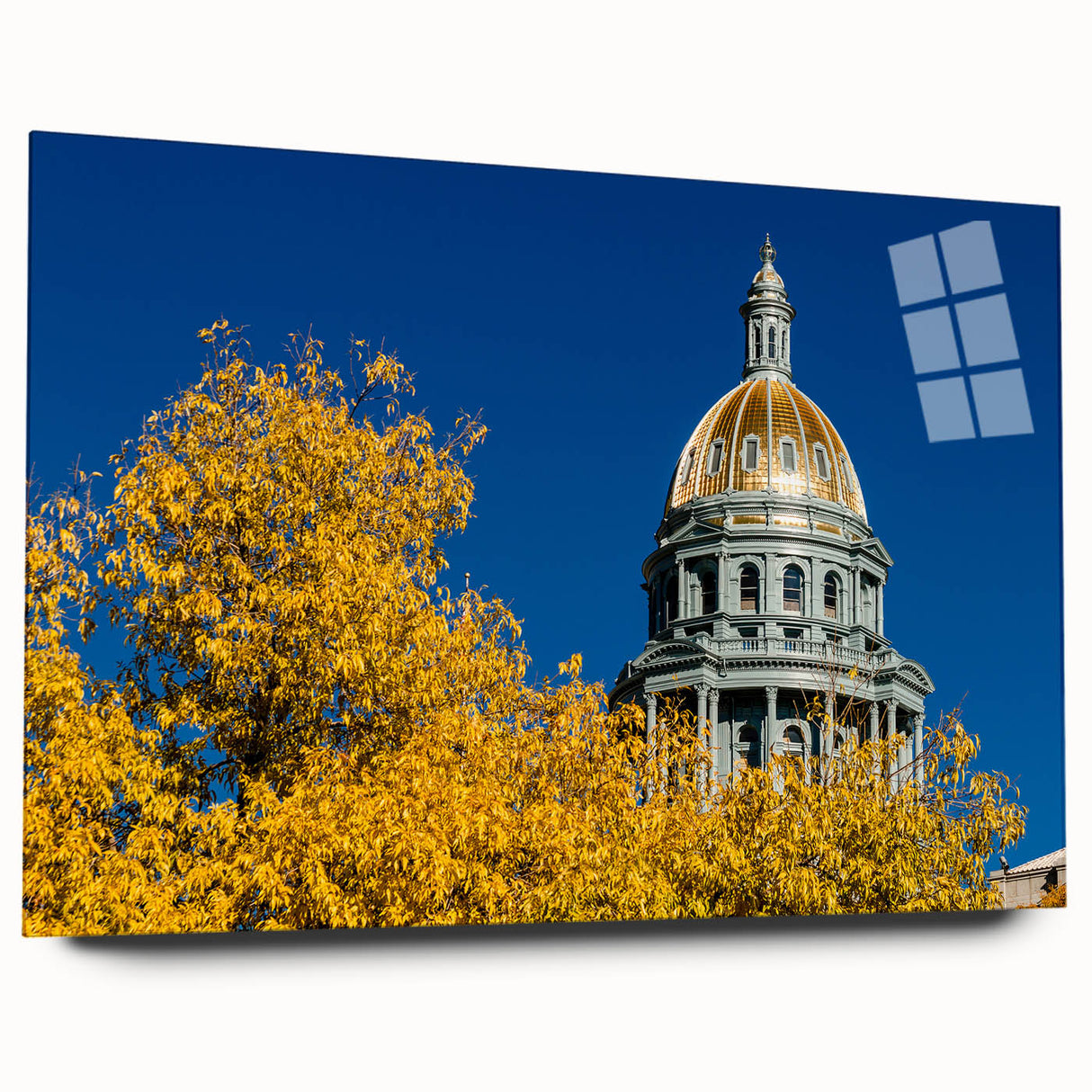 Large abstract wall art of Denver skyline in muted blue and gray tones on acrylic glass.