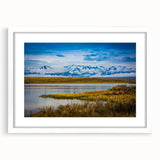 Abstract art print of Colorado Springs in muted green and blue tones on a white framed canvas.