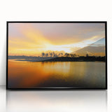 Large abstract wall art depicting the Everglades in muted green and blue tones, framed in black acrylic.