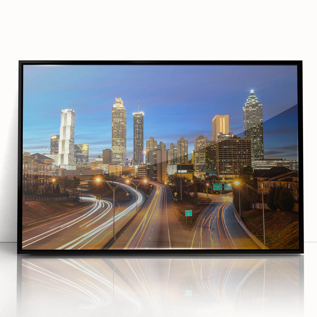 Large abstract wall art of Atlanta skyline in muted gray and blue tones on framed acrylic.