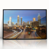Large abstract wall art of Atlanta skyline in muted gray and blue tones on framed acrylic.