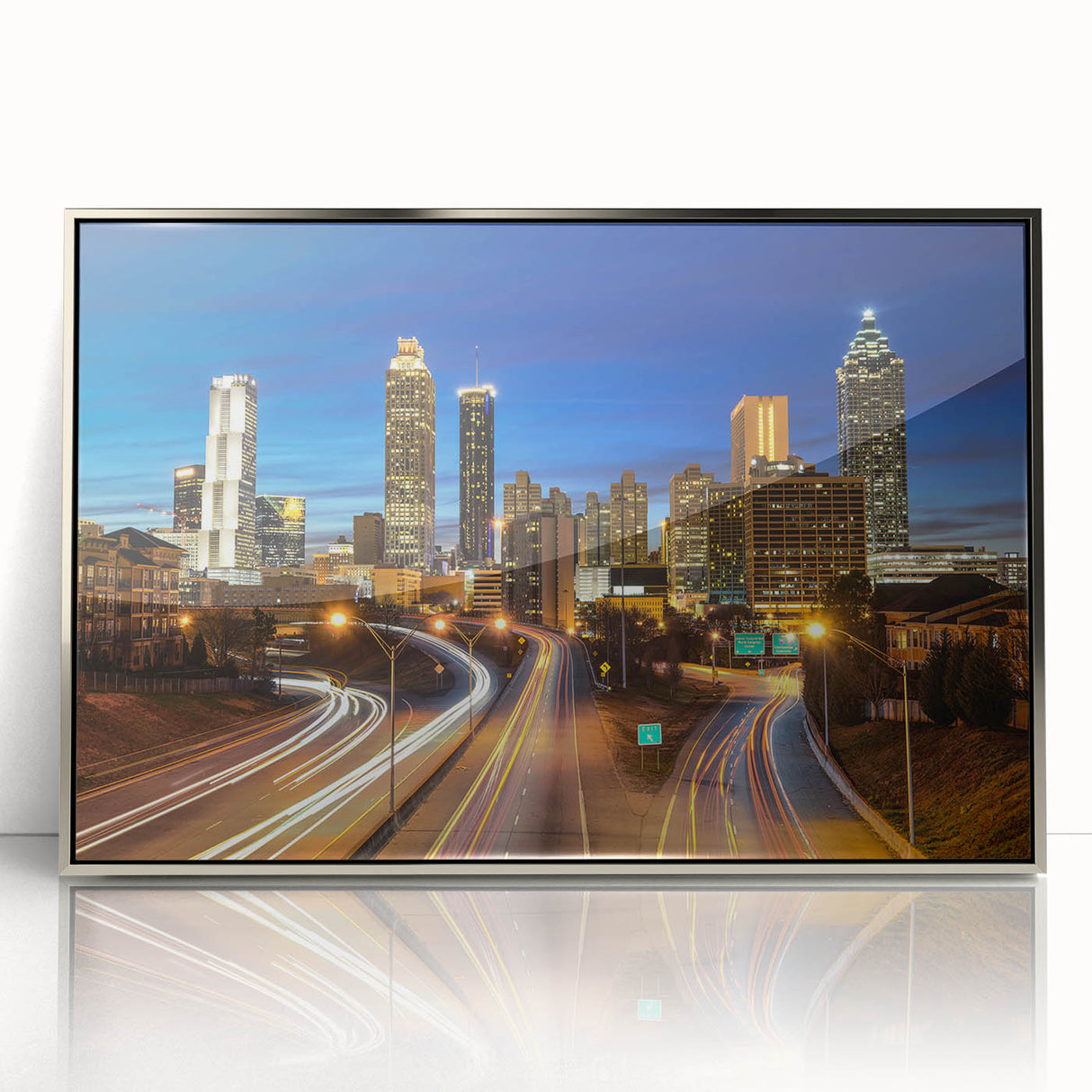 Mid-century modernist Atlanta skyline in muted gray and blue tones on a silver-framed acrylic print.