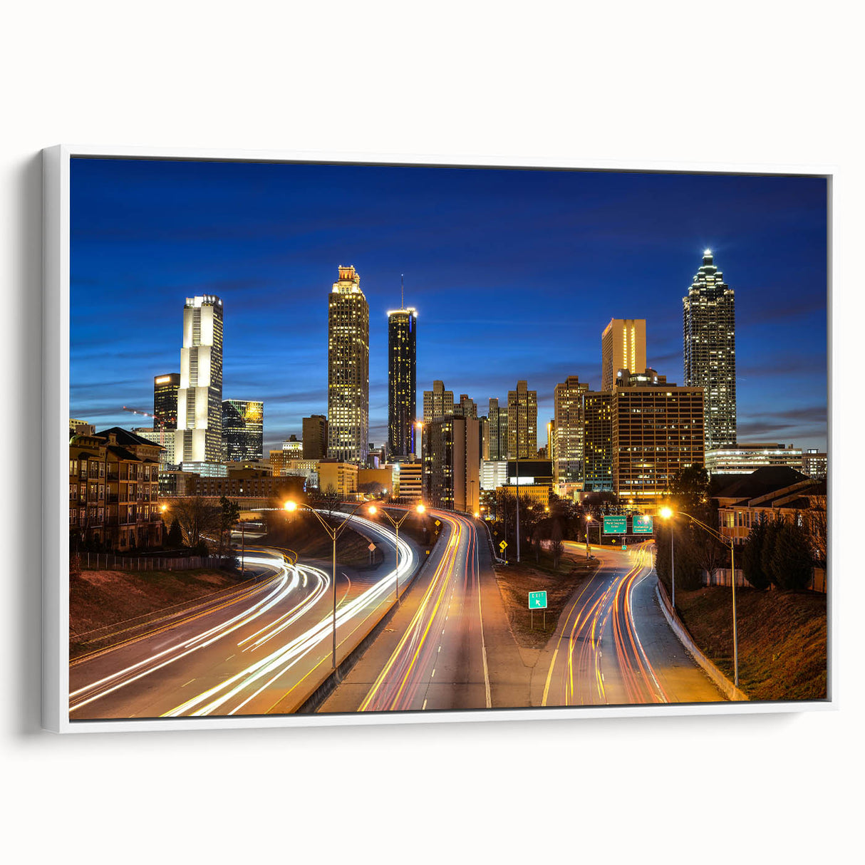 Vintage poster art of Atlanta skyline in vibrant colors on a large framed canvas, ideal for living room decor.