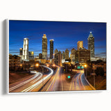 Vintage poster art of Atlanta skyline in vibrant colors on a large framed canvas, ideal for living room decor.