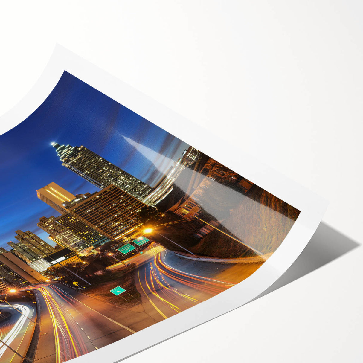 Extra large wall art of Atlanta skyline with line art flowers in muted colors on rolled canvas.