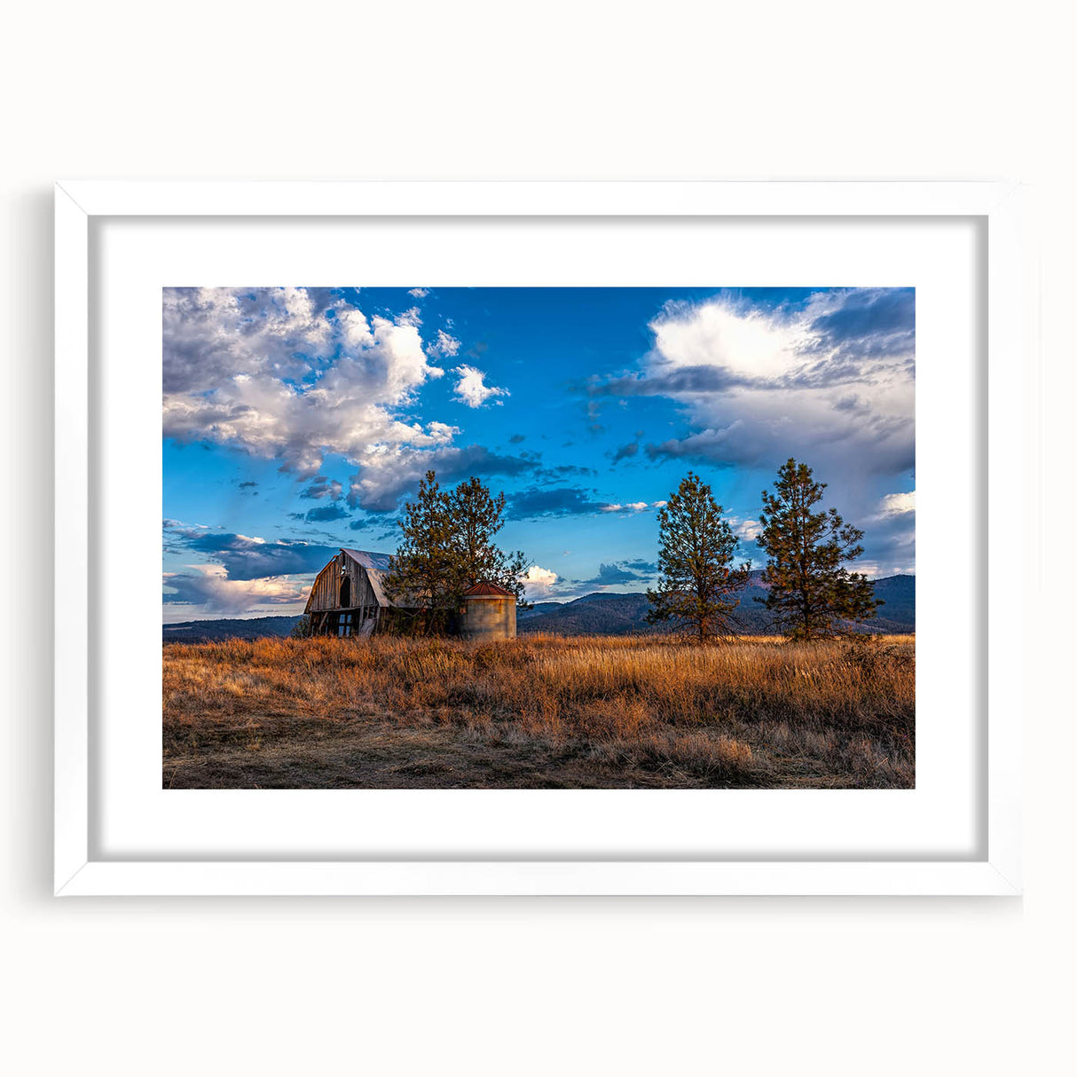 Abstract art print of Idaho scenery in muted earth tones on a framed white mat, ideal for dining room decor.
