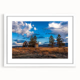 Abstract art print of Idaho scenery in muted earth tones on a framed white mat, ideal for dining room decor.