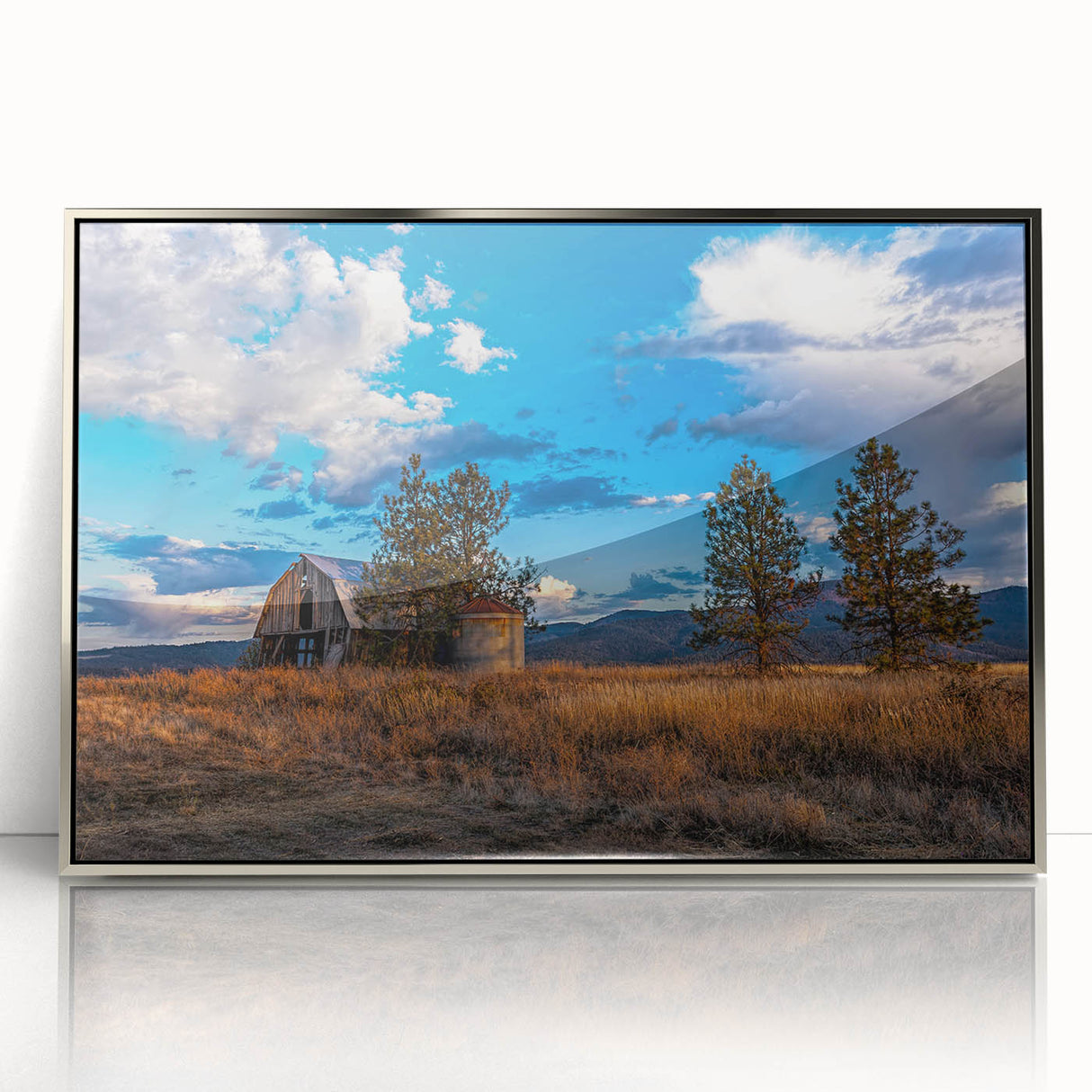 Mid-century modernist art depicting Idaho scenery in muted earth tones on a silver-framed acrylic print.