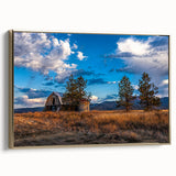 Framed canvas featuring a vintage-style landscape painting of Idaho scenery in muted earth tones.