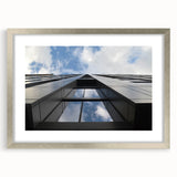 Textured art print of Chicago skyline in abstract style with vibrant blue and silver hues on a framed canvas.