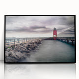 Large abstract wall art depicting Lake Michigan in muted blue tones, framed in black acrylic.