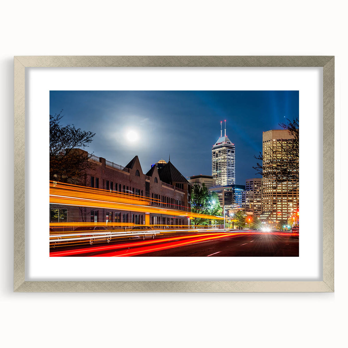 Textured art print of abstract Indianapolis skyline in muted gray and blue tones on a silver-framed canvas.