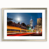 Textured art print of abstract Indianapolis skyline in muted gray and blue tones on a silver-framed canvas.
