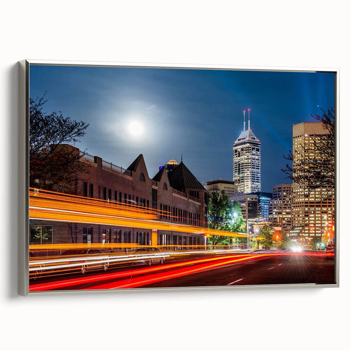 Framed canvas landscape art painting of Indianapolis skyline in muted gray and vibrant blues, ideal for office decor.