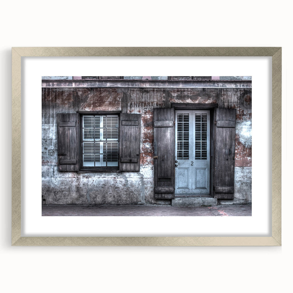 Textured abstract art print of New Orleans in muted earth tones on a framed silver mat, ideal for bedroom art.