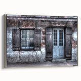 Framed canvas of a colorful New Orleans landscape, featuring vintage-style art with black and silver tones.
