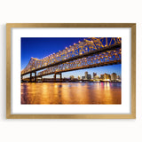 Extra large abstract art print of Louisiana scenery in muted earth tones on a textured canvas, framed in gold.