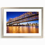 Textured abstract art print depicting Louisiana scenery in muted green and brown tones, framed in silver.