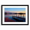 Abstract art print depicting textured colorful Maine scenery, in a black frame with mat, ideal for living room decor.