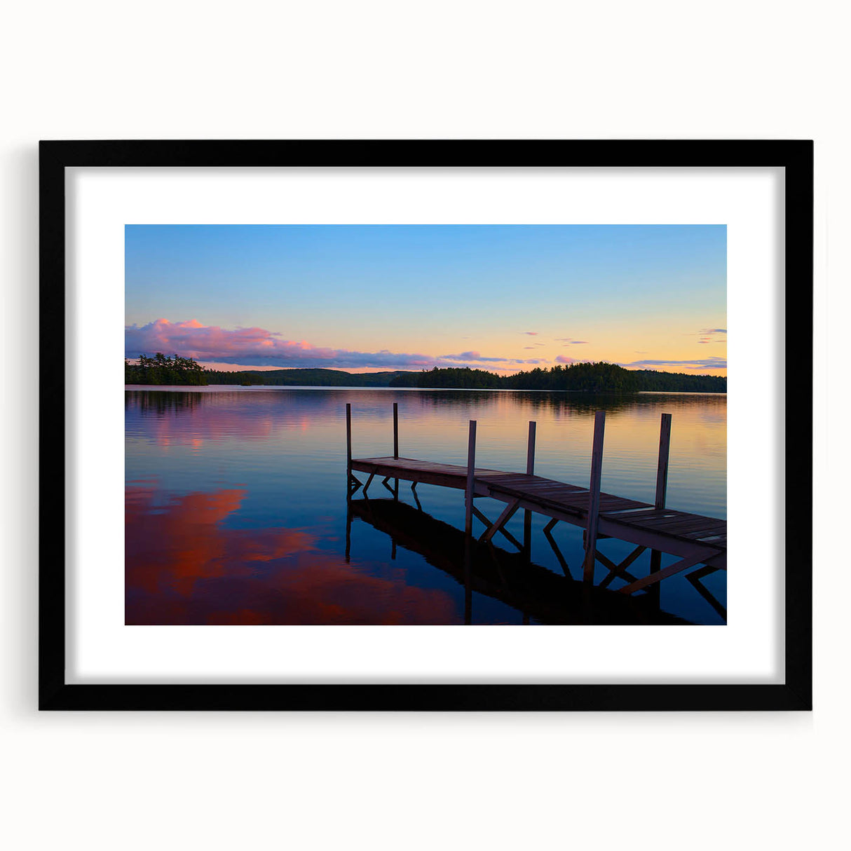 Abstract art print depicting textured colorful Maine scenery, in a black frame with mat, ideal for living room decor.