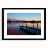 Abstract art print depicting textured colorful Maine scenery, in a black frame with mat, ideal for living room decor.