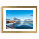 Extra large abstract art print of Chesapeake Bay in textured hues of blue and gold, framed in gold.