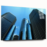 Large abstract wall art depicting the Detroit skyline in muted gray and blue tones on acrylic glass.