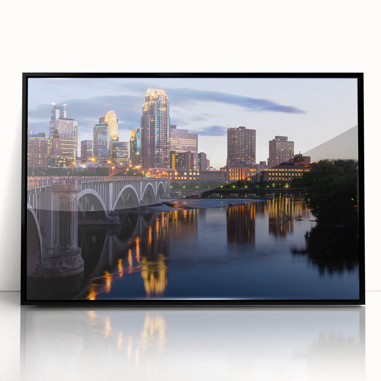 Large abstract wall art depicting the Minneapolis skyline in muted gray tones on a framed acrylic print.