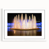 Abstract art print of Kansas City skyline in muted blue and gray tones on a framed white mat, ideal for dining room decor.