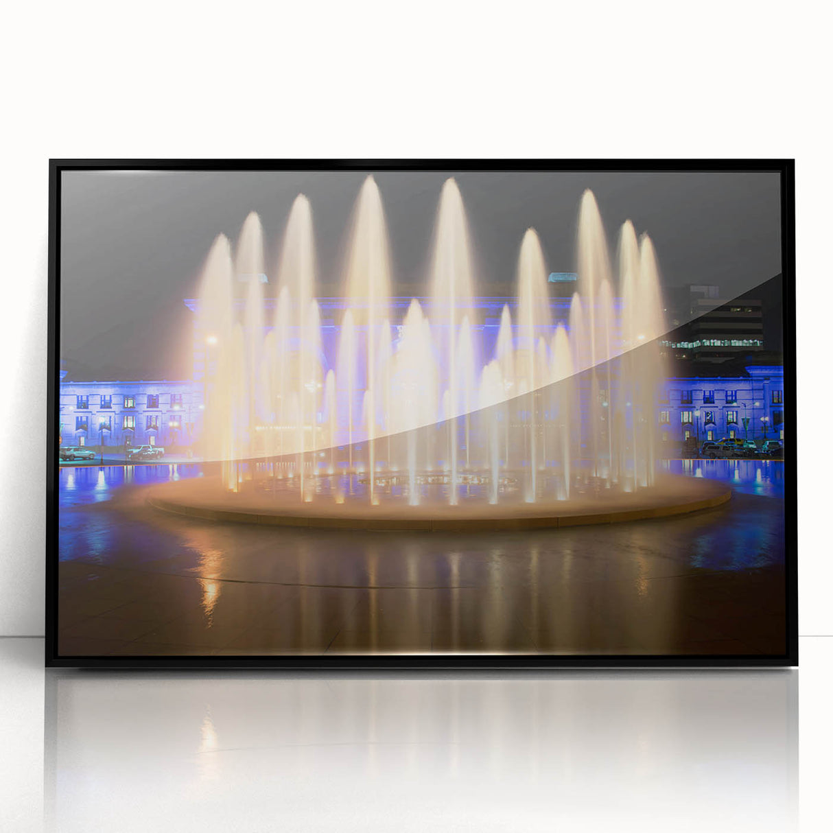 Large abstract wall art depicting Kansas City skyline in muted gray and blue tones, framed in black acrylic.