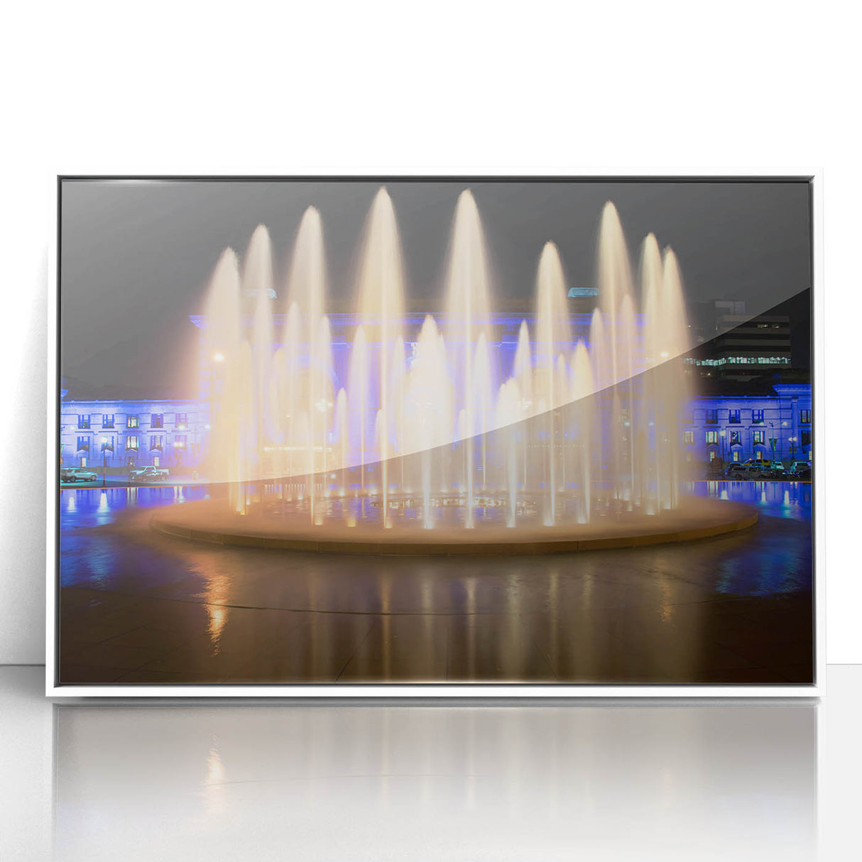 Acrylic print of Kansas City skyline in muted gray and blue tones, framed in white, suitable for modern art wall decor.