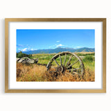 Extra large wall art featuring a textured abstract print of Montana scenery in muted earth tones, framed in gold.