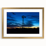 Abstract art print depicting textured scenery of Nebraska in muted earth tones, framed in gold, ideal for living room decor.