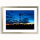 Textured abstract art print depicting a Nebraska scenery in muted earth tones, framed in silver, suitable for bedroom decor.