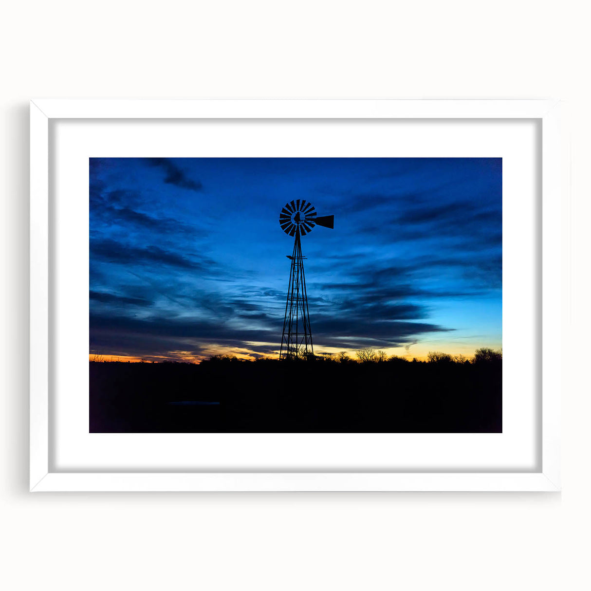 Abstract art print of Nebraska scenery in muted earth tones on a white-framed mat, ideal for dining room decor.