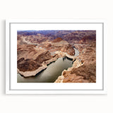 Abstract art print of Hoover Dam in muted gray and blue tones, framed with a white mat.