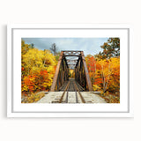Abstract art print of a New Hampshire landscape in muted earth tones, framed with a white mat.