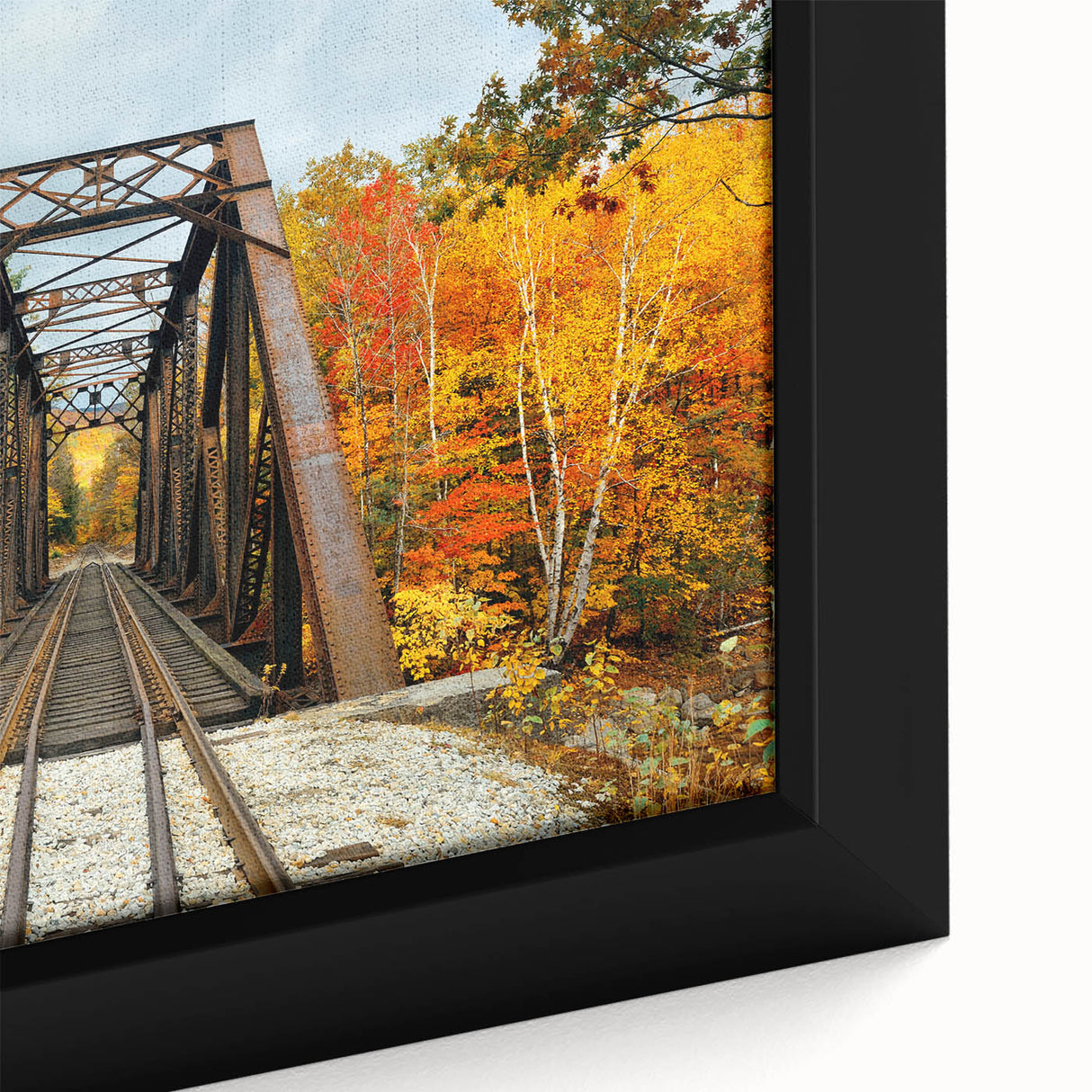 Close-up of a textured black wall art featuring a New Hampshire scenery on a framed canvas, with colorful accents.