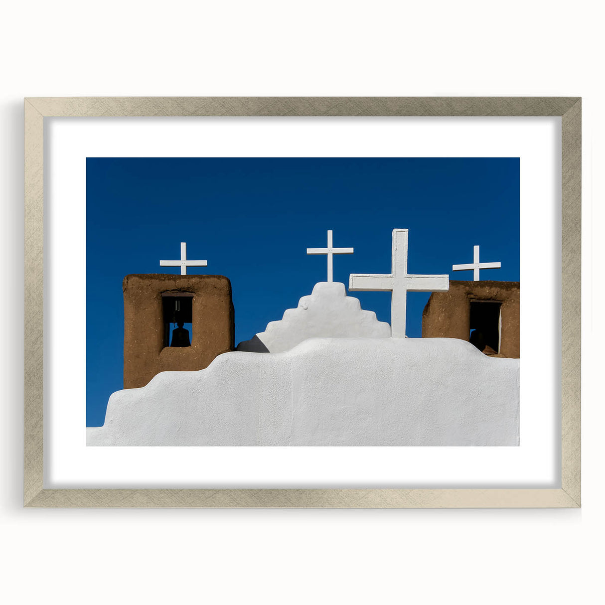 Textured abstract art print of New Mexico scenery in muted earth tones, framed in silver, ideal for bedroom art.