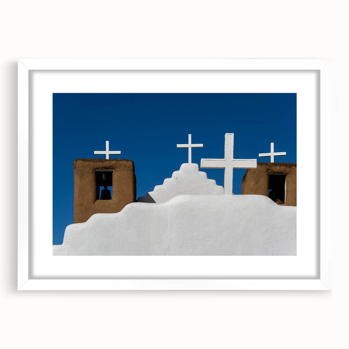 Abstract art print depicting New Mexico scenery in muted earth tones on a white framed canvas.