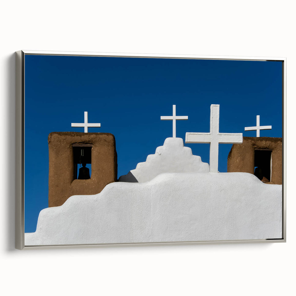 Framed canvas of a New Mexico landscape in muted earth tones, ideal for adding a vintage touch to living room decor.