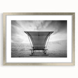 Textured art depicting abstract shapes in soft beige and white tones on a framed canvas, ideal for bedroom wall decor.