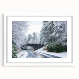 Abstract art print of the Blue Ridge mountains in muted blue and green tones on a framed white mat.